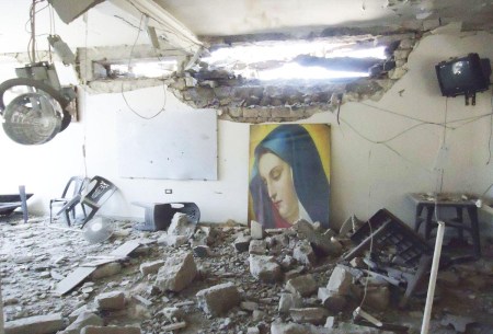 The damaged Im Al-Zinar church is seen in the old city of Homs