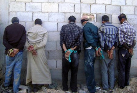 detained men blindfolded