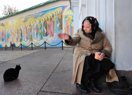 Ukraine woman beggar cat